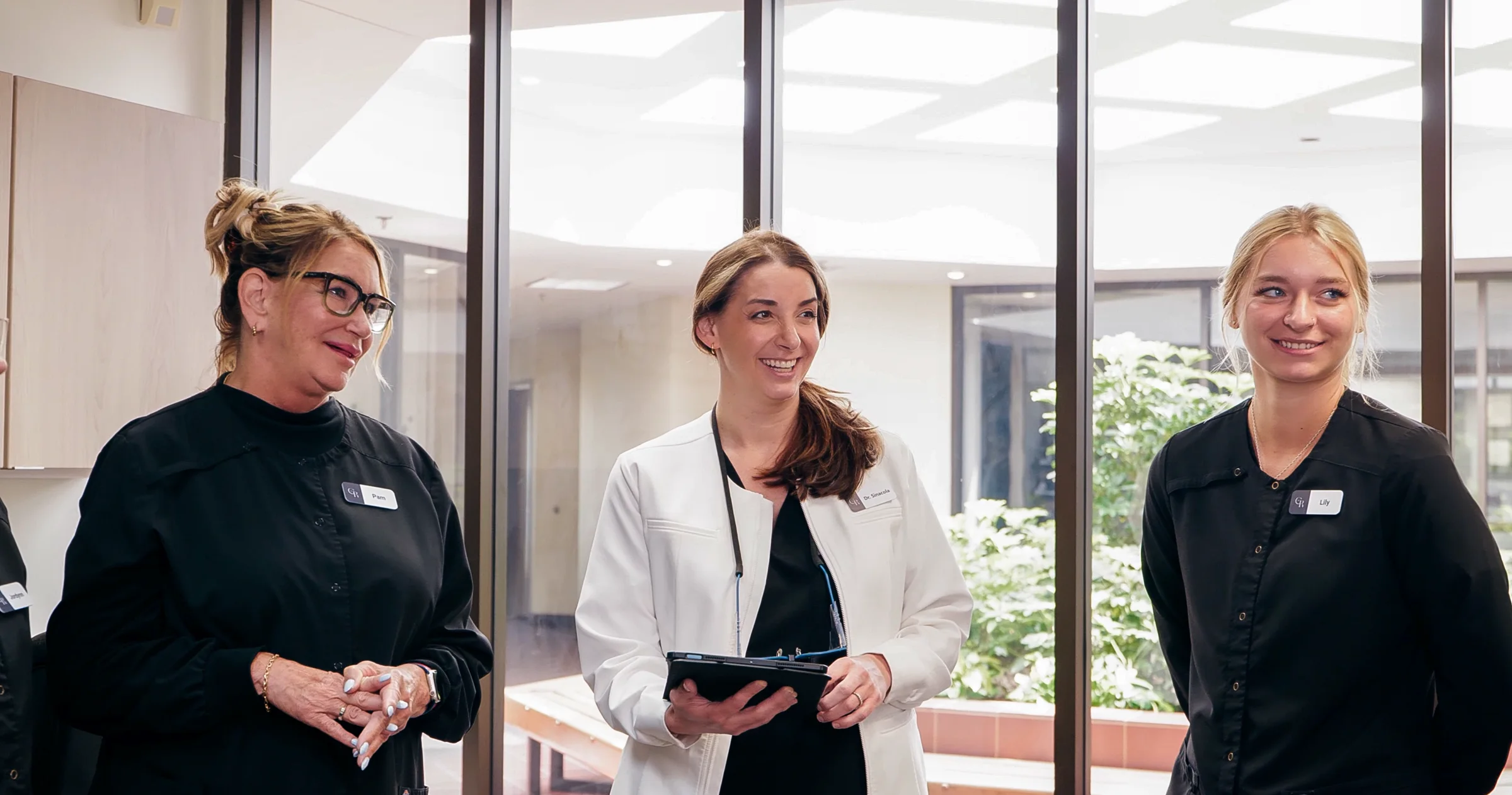 Our care team, providing LANAP laser gum disease treatment, at our periodontist office in Grand Rapids, MI.